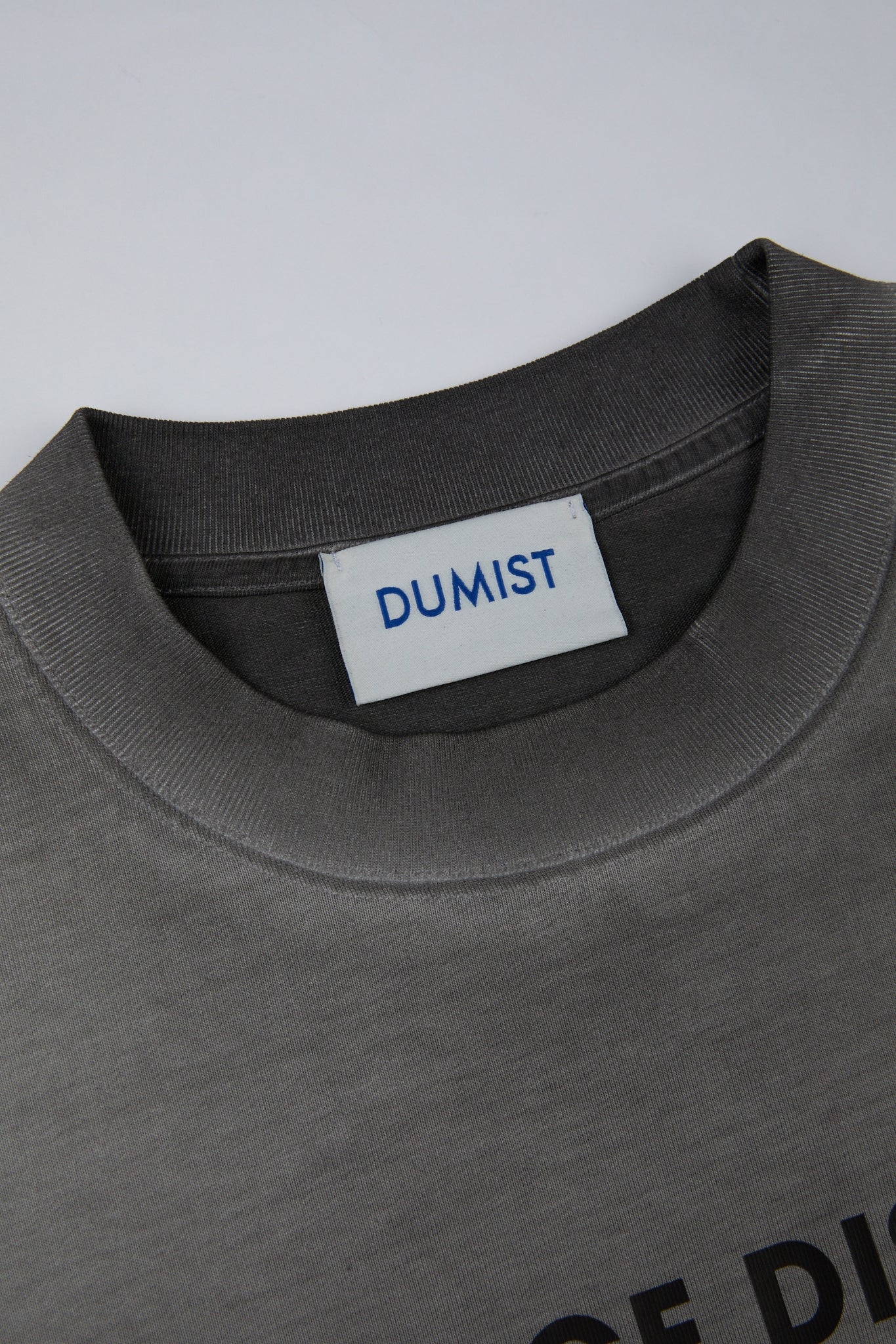 DUMIST - GREY TSHIRT TV's LOGO